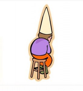 A student wearing dunce cap being disciplined
